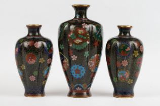 A pair of Chinese Cloisonne vases together with a larger example/