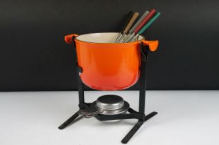 Le Creuset cast iron fondue set complete with stand, burner and six sticks. Measures approx 21.5cm