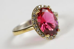 Silver Gilt Dress Ring with large faux ruby surrounded by CZs