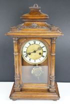 Early 20th century Vienna style wooden cased mantle clock, with glazed door, pendulum & key. (