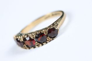 A fully hallmarked 9ct gold ladies ring set with five graduated garnets.