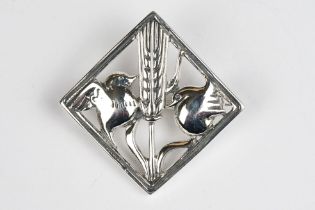 A Silver Brooch with bird decoration