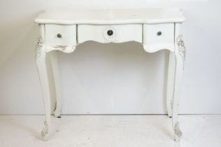 French style White Dressing / Side Table with shaped top and three drawers, raised on moulded