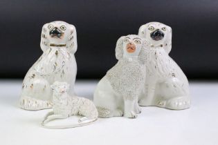 Pair of 19th Century Victorian Staffordshire fire dogs, together with a Staffordshire poodle and a