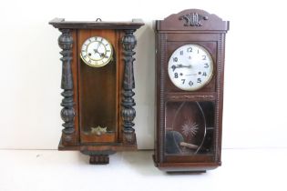 Two 20th Century wall clocks to include a Vienna regulator wall clock, and a later similar example