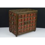 Late 19th / early 20th century gilt & painted wooden box with drop front, carved floral motif & stud
