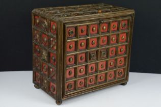 Late 19th / early 20th century gilt & painted wooden box with drop front, carved floral motif & stud