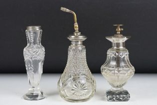 An antique cut glass dressing table set with sterling silver collars.