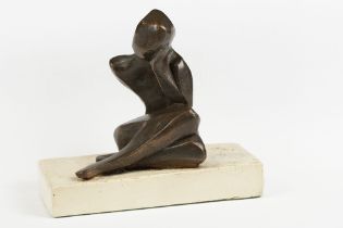 A stylised Bronze figure on stone base, signed M.G. and dated 1987 to base.