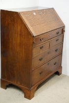 George III Oak Bureau, the fall front opening to a fitted interior, over two short and three long