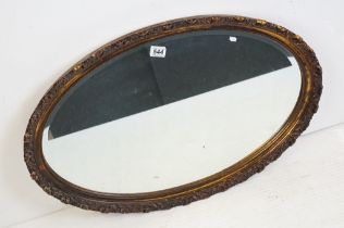 Bevelled Edge Oval Mirror with ornate gilded acanthus decoration, 82cm long