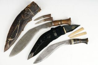 Two Vintage Kukuri Knives To Include A Full Size Example, Both Complete With Scabbards.