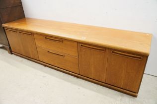 Mid 20th century G-Plan style Teak Sideboard with central bank of two drawers flanked either side by