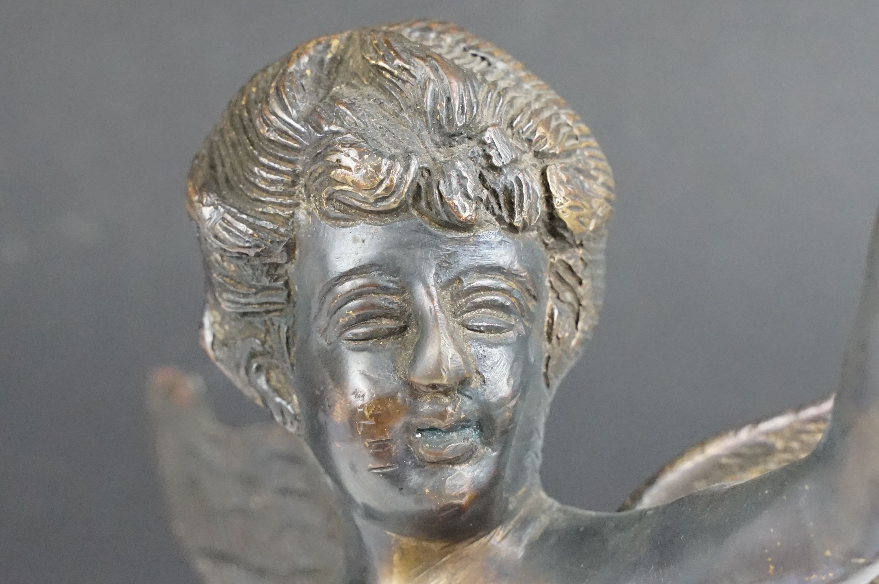 Bronze Cupid / winged cherub sculpture with loin cloth, raised on a circular base of naturalistic - Image 5 of 10