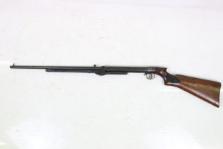 A vintage B.S.A. air rifle, BSA logo carved to the polished wooden, overall length approx 110cm.