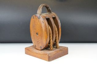 Oak ships pulley block with twin rollers, raised on a rectangular base, approx 34cm high