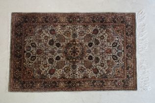 Part Silk Rug with floral pattern on a cream and green ground, 79cm x 126cm