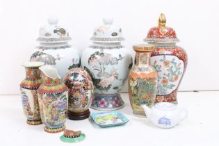 Collection of oriental ceramics to include a pair of lidded vases with lotus flower detailing,