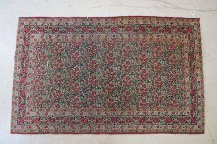 Kerman Rug with all-over red roses, flowers and leaves, highlights of indigo, the border with