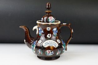 19th Century Measham pottery bargeware teapot & cover, having typical moulded floral motifs on a