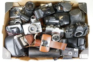 Collection of SLR and 35mm film cameras with lenses, featuring Canon, Olympus, Pentax and Minolta