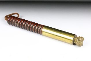 An Antique brass tip staff, with ribbed wood handle and typical coronet finial