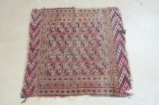 Turkoman Rug with four rows of seven guls, worn, 105cm x 99cm