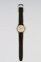 A gents 9ct gold cased Garrards wristwatch presented by Rolls Royce in 1981.