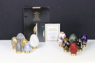 A collection of ornamental eggs to include polished stone and cut glass examples.