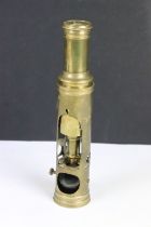 An antique brass students microscope marked G & W Proctor, London.