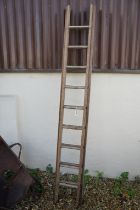 Large vintage wooden extending ladder, approx 242cm long (at its shortest length)