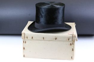 Woodrow & Sons of Manchester black silk top hat having a ventilation hole to top. Interior rim