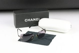 A pair of Channel ladies sunglasses complete case and box.