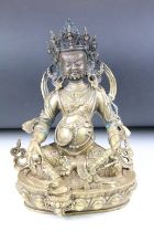 Cast bronze Tibetan Buddha modelled in a seated position on a lotus base with moulded details and