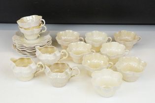 Belleek Cream Cob Lustre tea ware, first and second period, to include 8 cups, 12 saucers, 3 milk