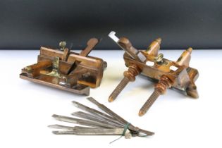 Two vintage wooden planes with brass details, to include a plough plane and a screw-stem example.