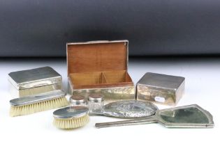 A collection of mixed hallmarked silver to include three cigarette boxes and a selection of vanity