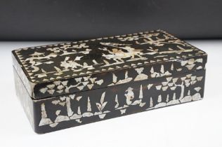 Japanese black lacquer box with mother of pearl inlaid decoration, depicting a male figure mounted