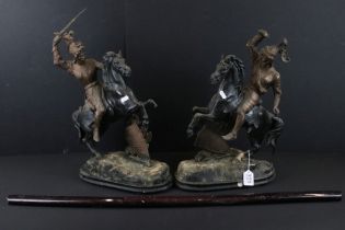 Pair of cast metal figurines in the form of knights on horse back, together with a reproduction