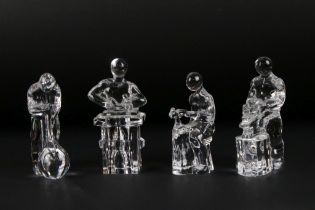 Four Orrefors Swedish glass paperweights in the form of craftsmen, to include glassblower,