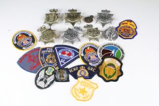 A collection of mixed Police badges to include helmet badges from various British constabilaries and