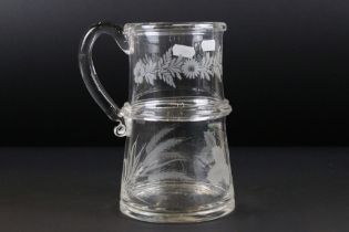 Late Georgian glass tankard of two tier construction having etched floral, grape vine and wheat