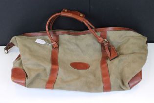Mulberry green canvas holdall weekend bag having brown leather banding and gold tone hardware with