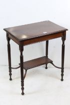 Early 20th century Mahogany Side Table raised on fluted supports united by a shelf below, label to