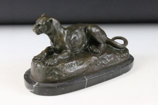 After Antoine-Louis Barye (French, 1795-1875) - A bronze figure of a recumbent panther, raised on a