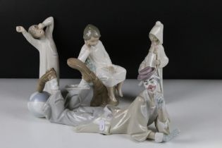 Four Lladro figurines to include a large recumbent clown figure, yawning boy, reading boy and hooded