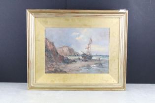 Gilt framed Oil Painting of a beached sailboat with figures in a cove with cliffs beyond, 25cm x