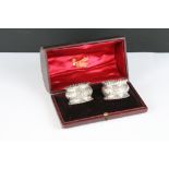A pair of fully hallmarked sterling silver napkin rings within original fitted retailers display