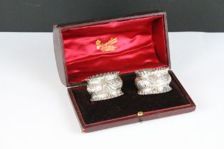 A pair of fully hallmarked sterling silver napkin rings within original fitted retailers display