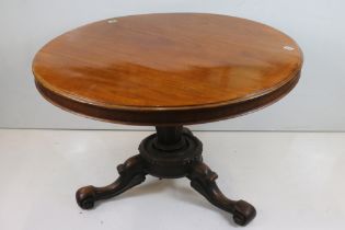 Mid Victorian Mahogany Circular Tilt Top Loo Table, raised on carved centre column with three scroll